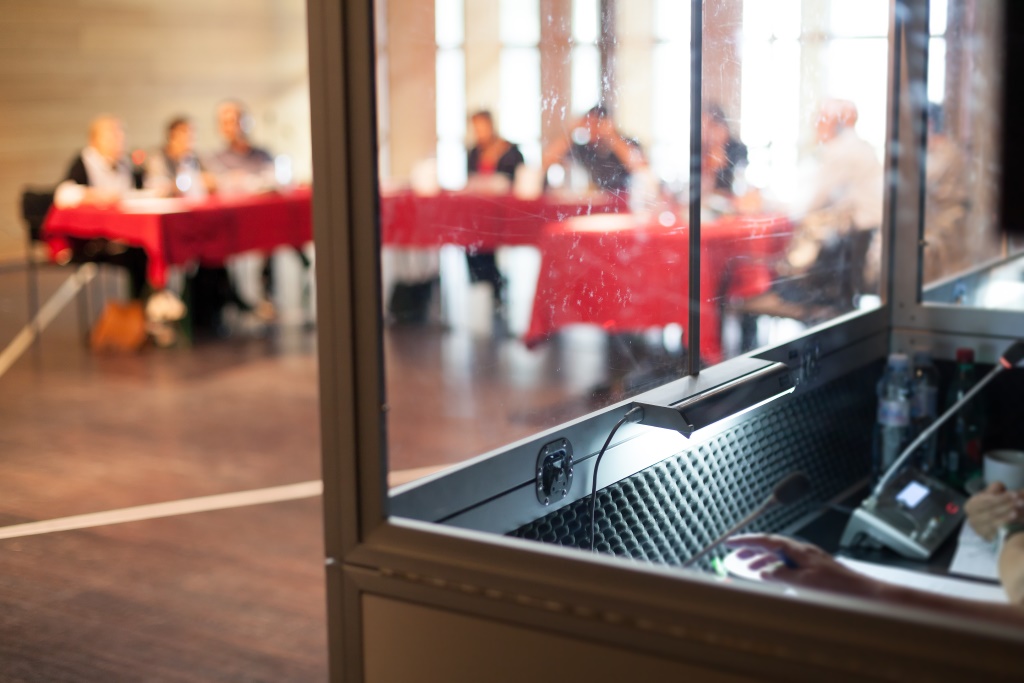 Simultaneous interpretation in a booth during a conference